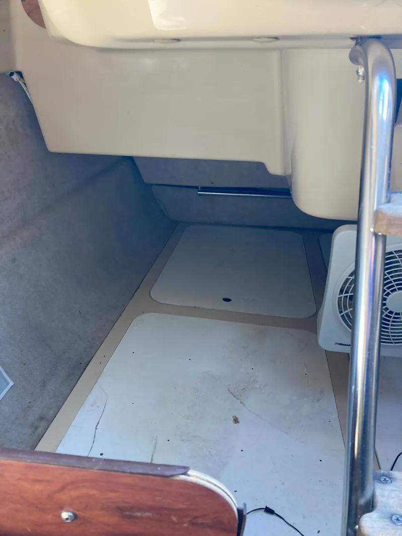 Slide: The Image of Interior of a 2007 MacGregor 26 boat with fan. - 21