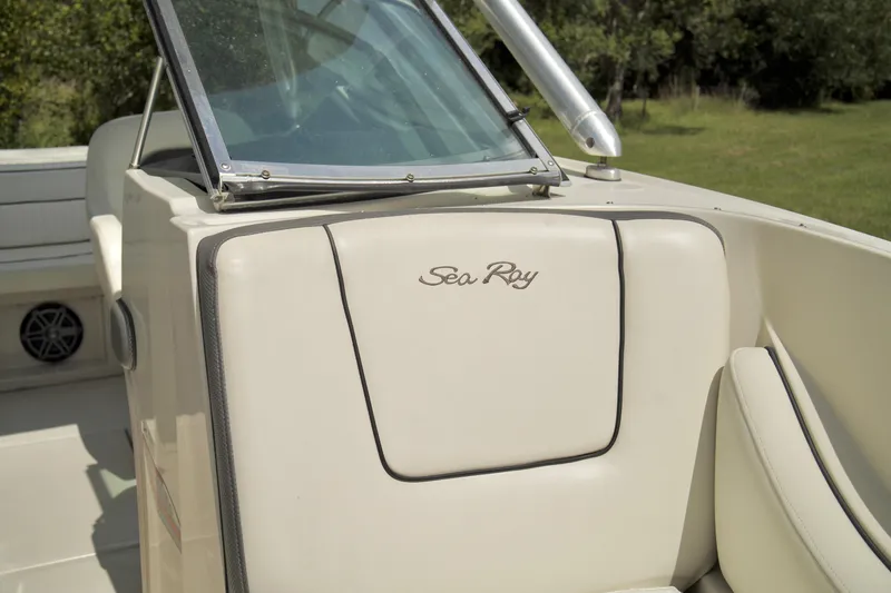 Slide: The Image of 2008 Sea Ray 230 Select Fission boat interior with windshield and seating. - 12