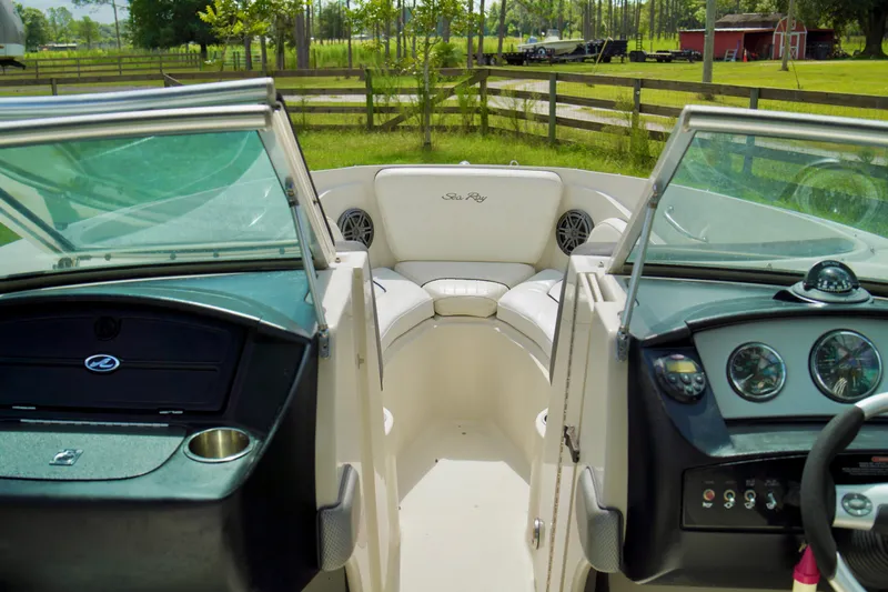 Slide: The Image of 2008 Sea Ray 230 Select Fission boat interior with dual consoles and seating area. - 17