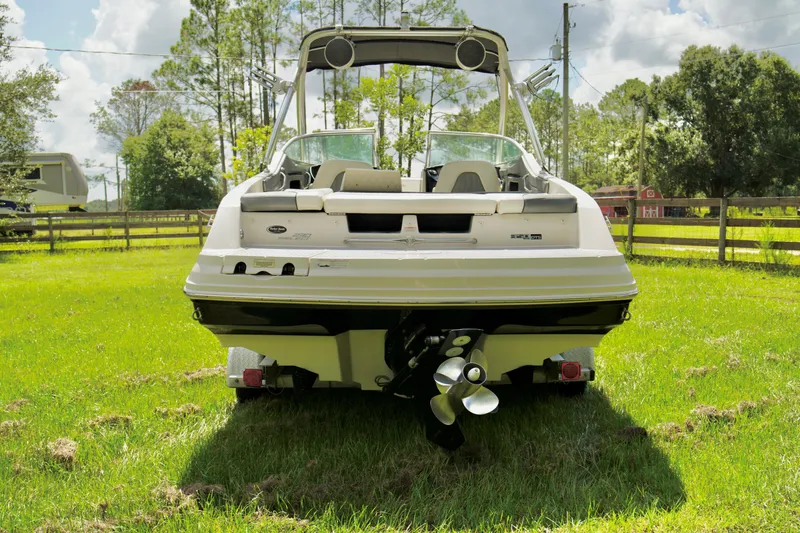 Slide: The Image of 2008 Sea Ray 230 Select Fission boat, rear view on grass. - 32