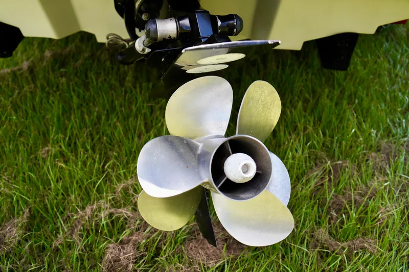 Slide: The Image of Propeller of a 2008 Sea Ray 230 Select Fission boat on grass. - 34