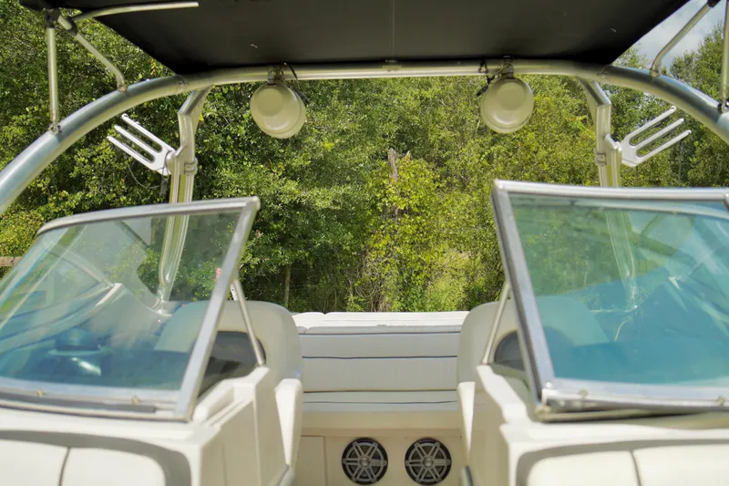 Slide: The Image of Interior view of a 2008 Sea Ray 230 Select Fission boat with open windshield. - 13