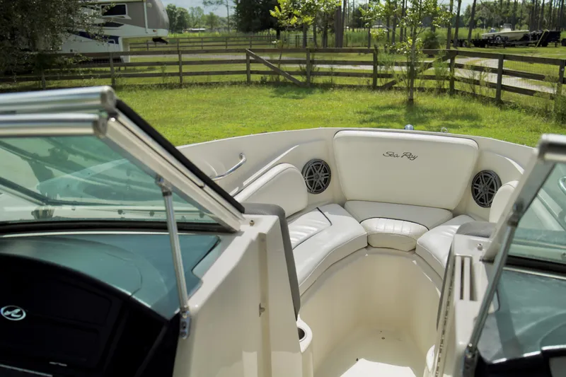 Slide: The Image of Interior of 2008 Sea Ray 230 Select Fission boat with white seating and open windshield. - 16