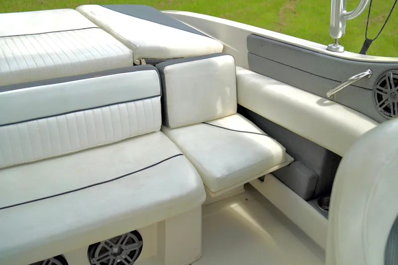 Slide: The Image of 2008 Sea Ray 230 Select Fission boat interior with white cushioned seating. - 27