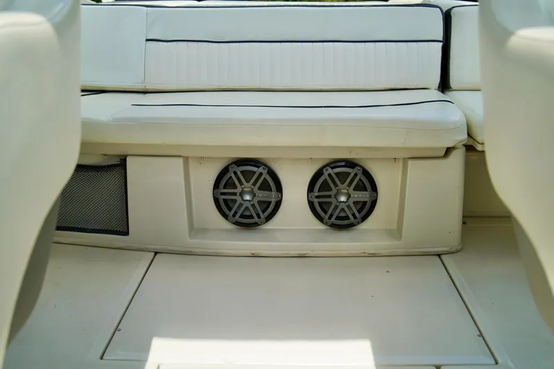 Slide: The Image of 2008 Sea Ray 230 Select Fission boat interior with dual speakers under seat. - 28