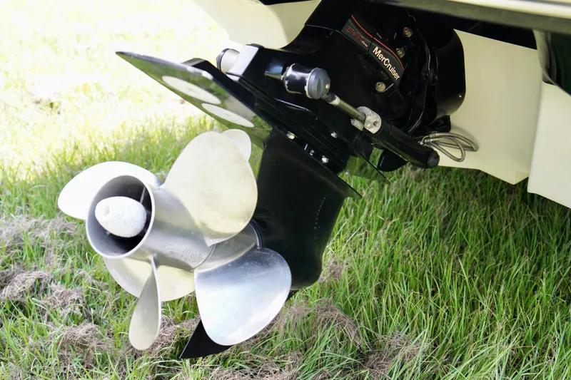Slide: The Image of Close-up of 2008 Sea Ray 230 Select Fission boat propeller on grass. - 33