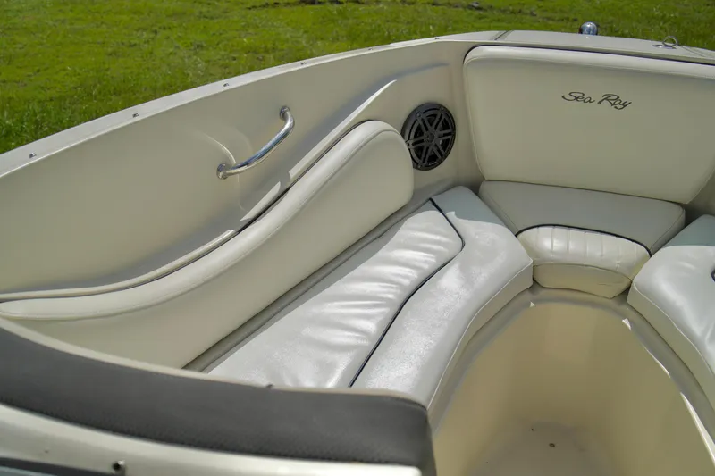 Slide: The Image of Interior seating of 2008 Sea Ray 230 Select Fission boat with white upholstery. - 8
