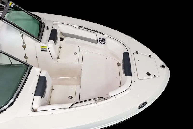 Slide: The Image of 2026 Robalo R207 Dual Console dashboard with steering wheel and Simrad display. - 7
