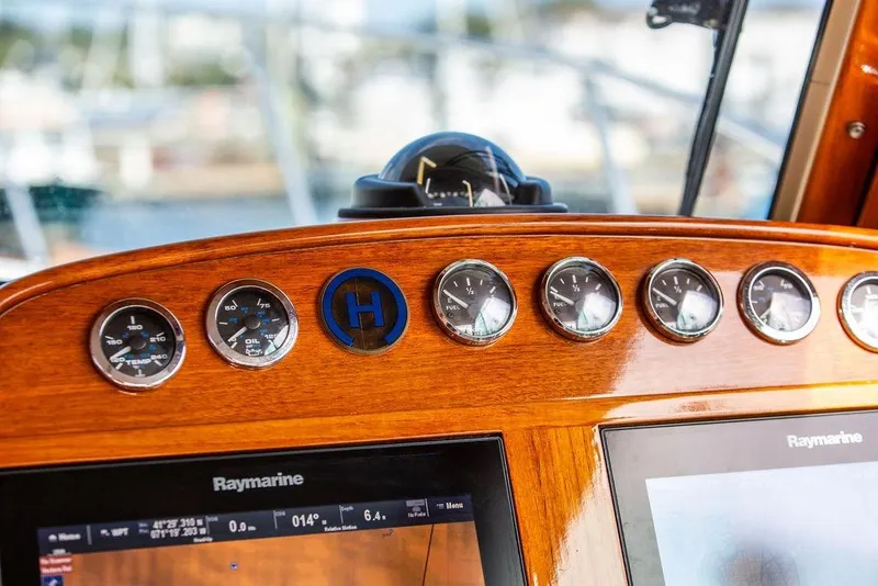 Slide: The Image of Hinckley Talaria 40 dashboard with gauges and Raymarine displays, 2005 model. - 18