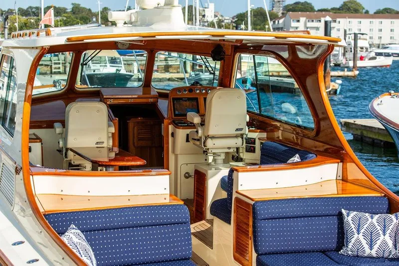 Slide: The Image of 2005 Hinckley Talaria 40 yacht interior with elegant seating and polished wood finish. - 2
