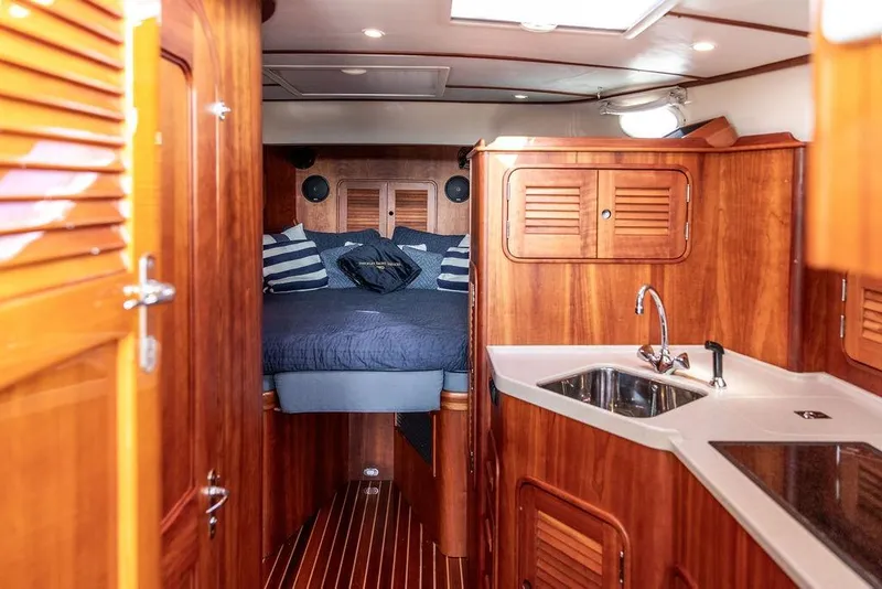 Slide: The Image of Luxurious 2005 Hinckley Talaria 40 yacht interior with wood finish and cozy cabin. - 28