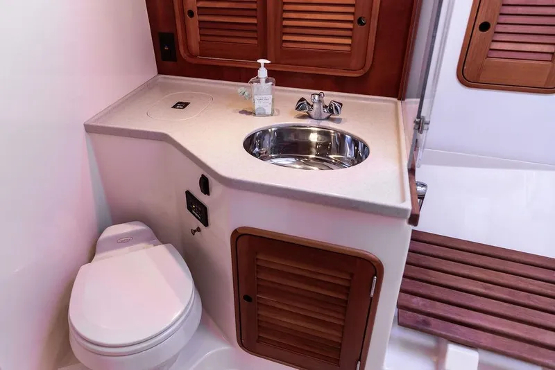 Slide: The Image of Luxury bathroom in 2005 Hinckley Talaria 40 yacht with sink and toilet. - 34