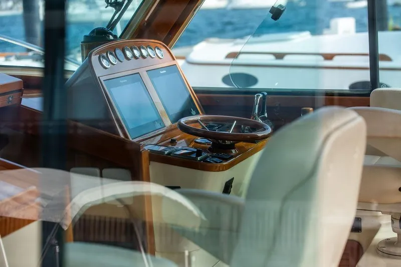 Slide: The Image of Interior view of 2005 Hinckley Talaria 40 yacht cockpit with steering wheel and navigation screens. - 15
