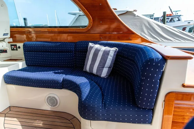 Slide: The Image of Luxurious seating on 2005 Hinckley Talaria 40 yacht with blue cushions and striped pillow. - 20