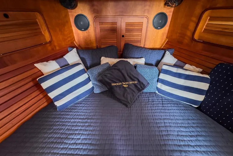 Slide: The Image of Luxurious cabin interior of 2005 Hinckley Talaria 40 yacht with striped pillows. - 29