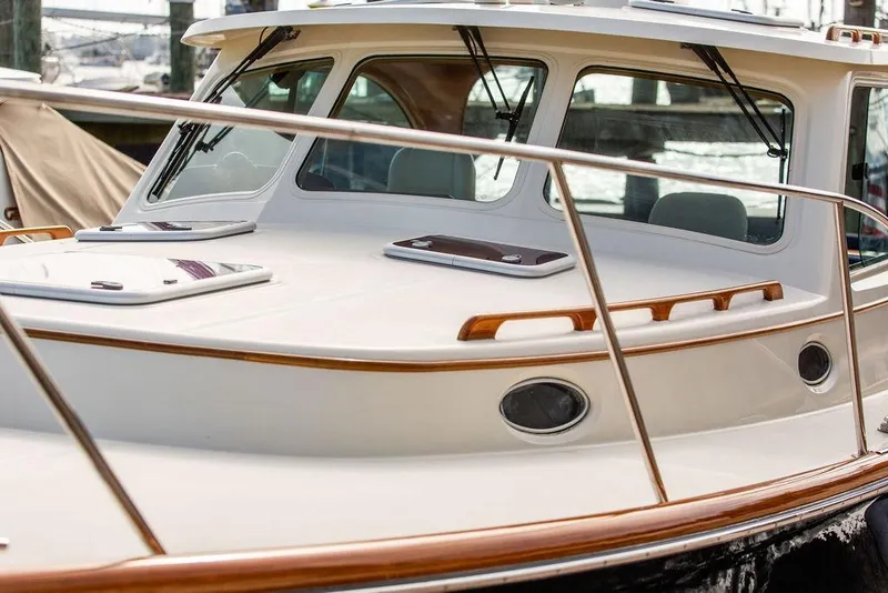 Slide: The Image of 2005 Hinckley Talaria 40 yacht with sleek design and polished wood accents. - 4