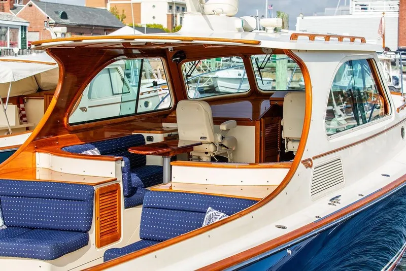 Slide: The Image of 2005 Hinckley Talaria 40 yacht with elegant wood and blue upholstery interior. - 8