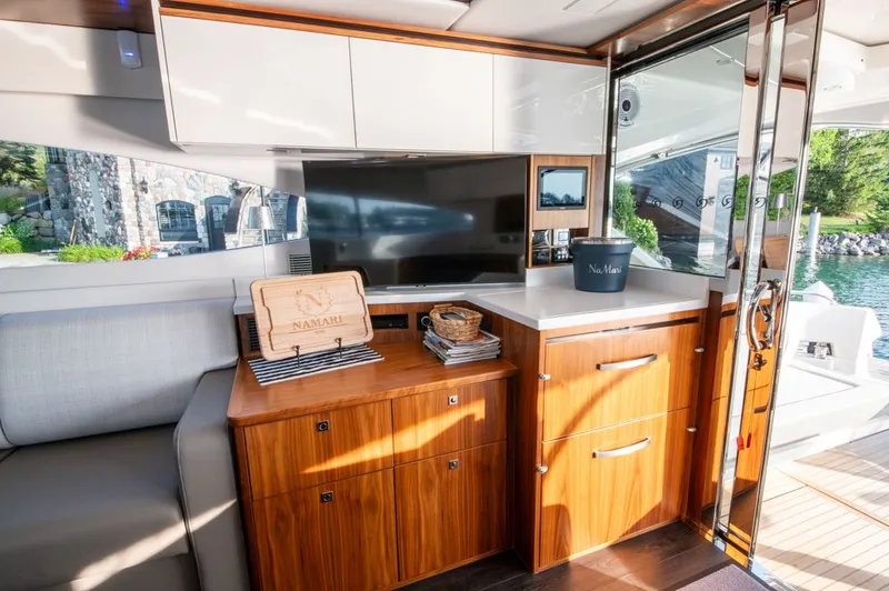 Slide: The Image of Luxurious interior of 2022 Riviera 6000 Sport Yacht Platinum with modern cabinetry and scenic view. - 23