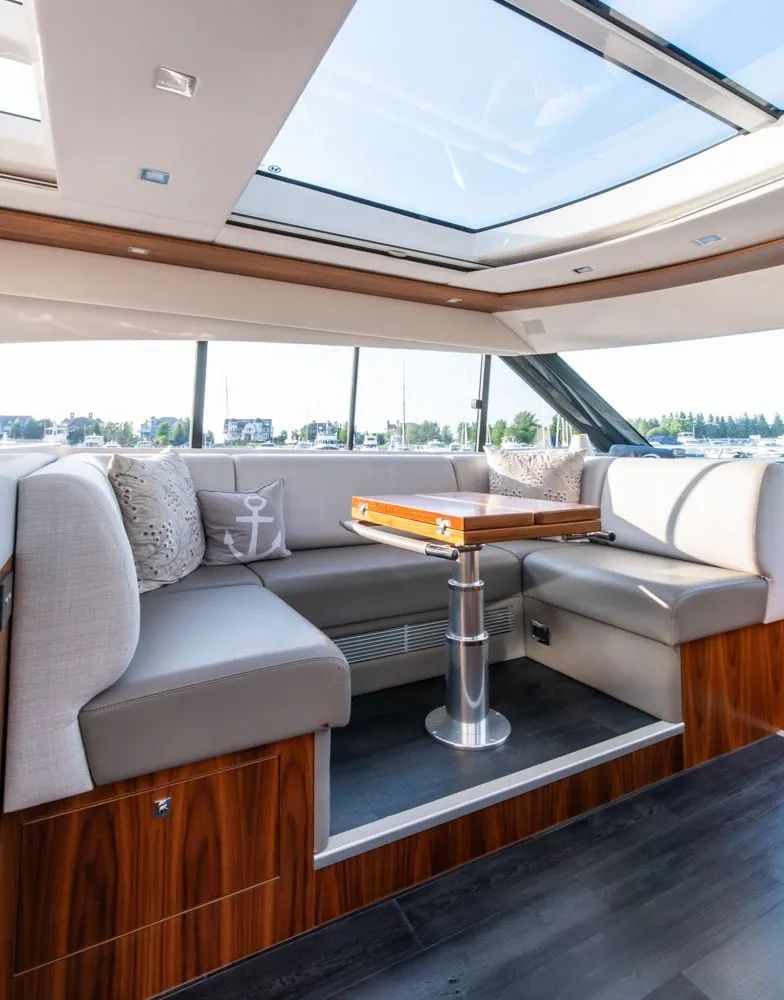 Slide: The Image of Luxurious interior of 2022 Riviera 6000 Sport Yacht Platinum with skylight and elegant seating. - 29