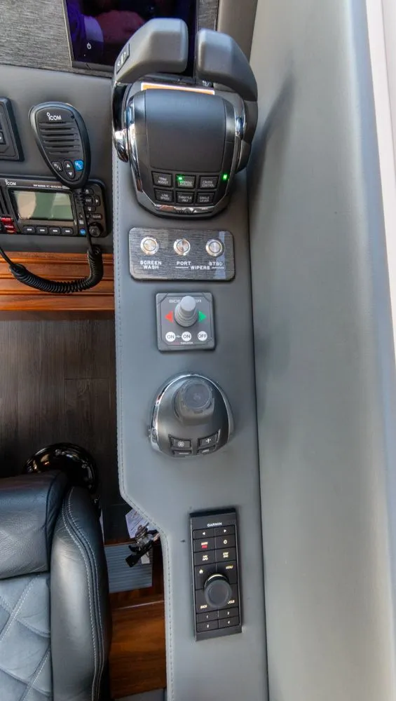 Slide: The Image of Control panel of 2022 Riviera 6000 Sport Yacht Platinum with advanced navigation and communication systems. - 35