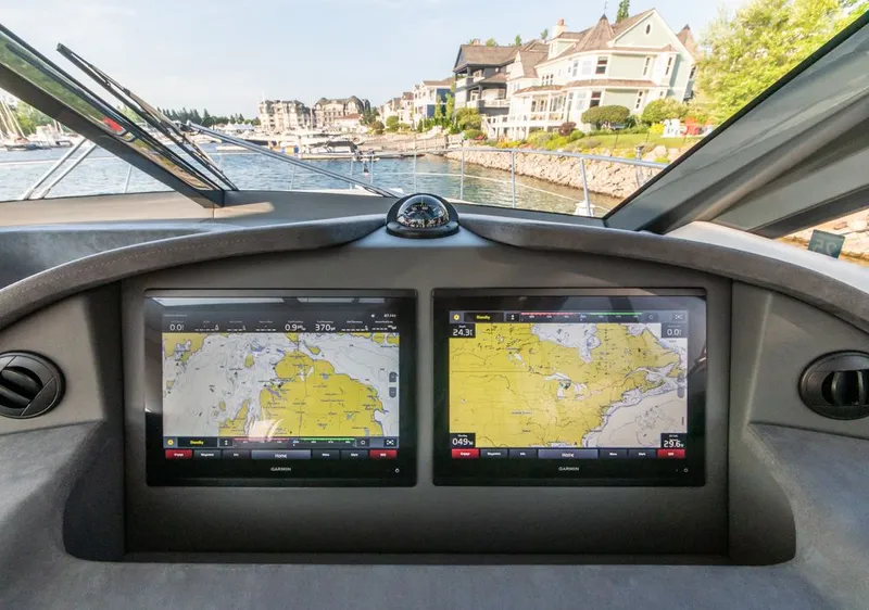 Slide: The Image of Cockpit view of 2022 Riviera 6000 Sport Yacht Platinum with navigation screens. - 37