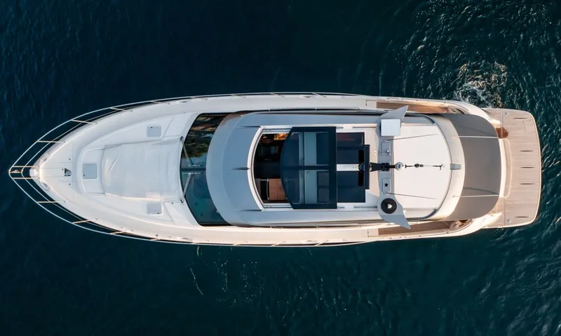 Slide: The Image of Aerial view of 2022 Riviera 6000 Sport Yacht Platinum on water. - 4