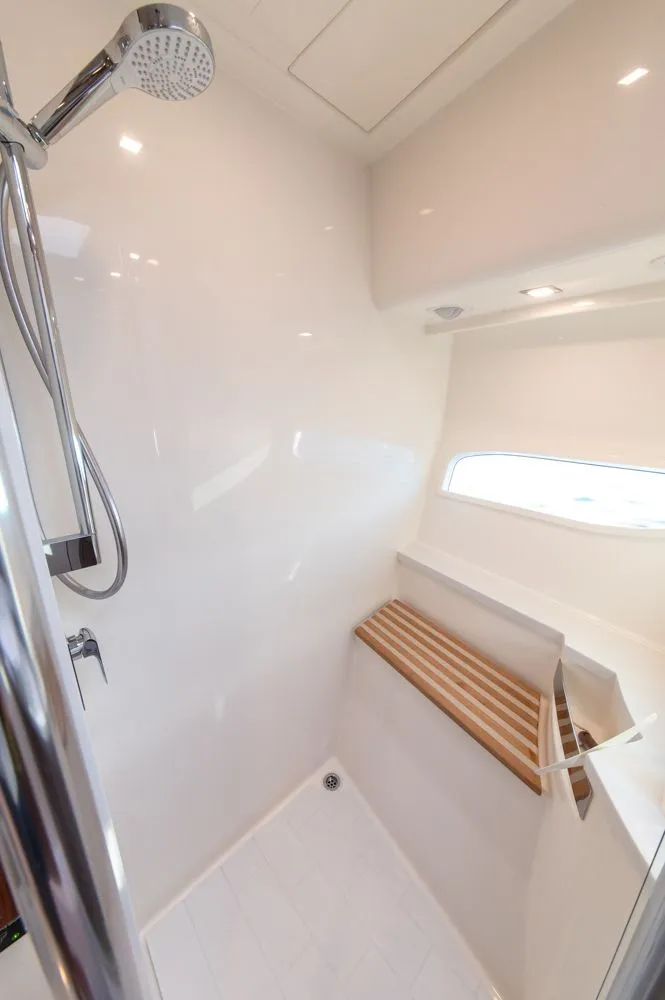 Slide: The Image of Shower area in 2022 Riviera 6000 Sport Yacht Platinum, featuring sleek design and modern fixtures. - 49
