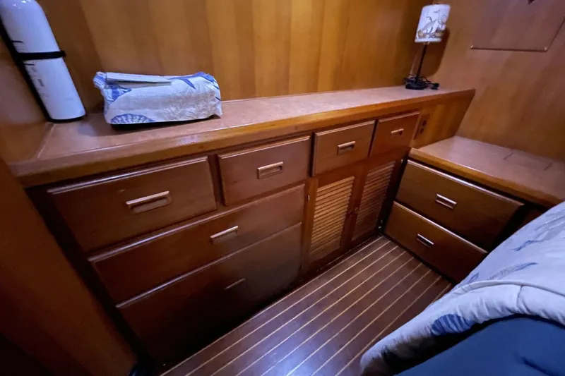 Slide: The Image of Wooden interior of 1986 NOVA MARINE 36 Sundeck with drawers and storage. - 7