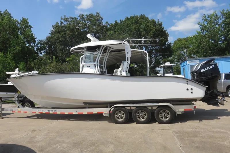 Slide: The Image of 2020 Cape Horn 31 T boat on trailer with Suzuki outboard motor. - 0