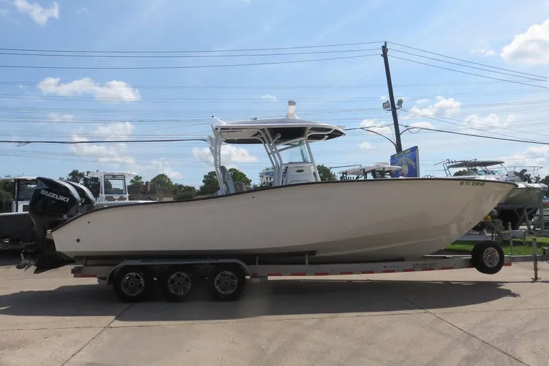 Slide: The Image of 2020 Cape Horn 31 T boat with upgrades, including new Suzuki engines and Seakeeper technology. - 1