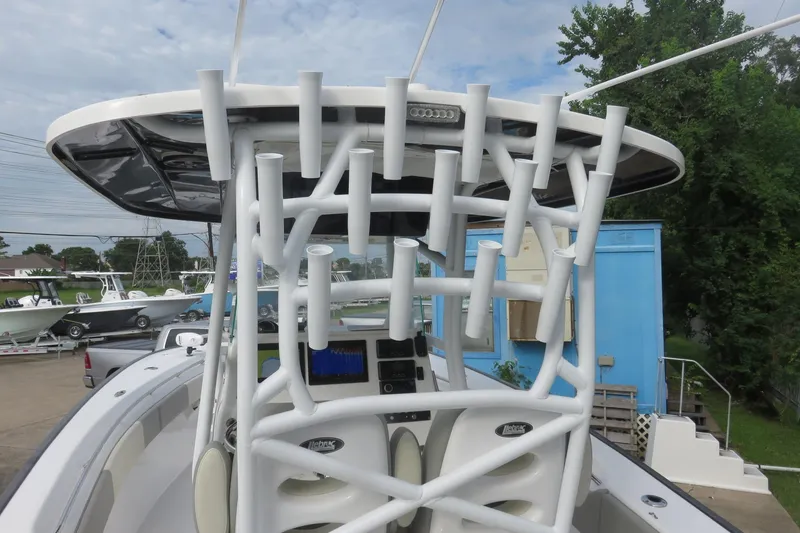 Slide: The Image of 2020 Cape Horn 31 T boat with Garmin radar, parked near a blue building. - 10