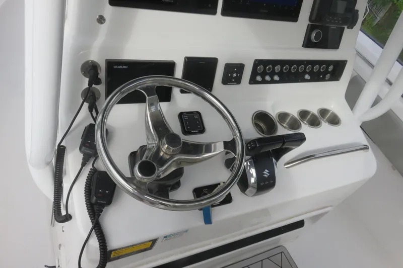 Slide: The Image of 2020 Cape Horn 31 T boat interior with seating and storage, parked near trucks. - 15