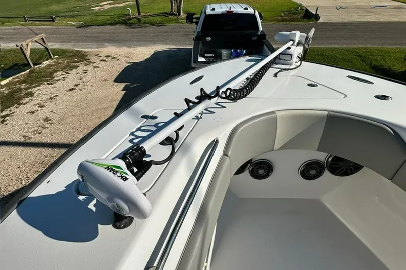 Slide: The Image of 2020 Cape Horn 31 T boat with dual gray captain seats and Suzuki engines. - 18