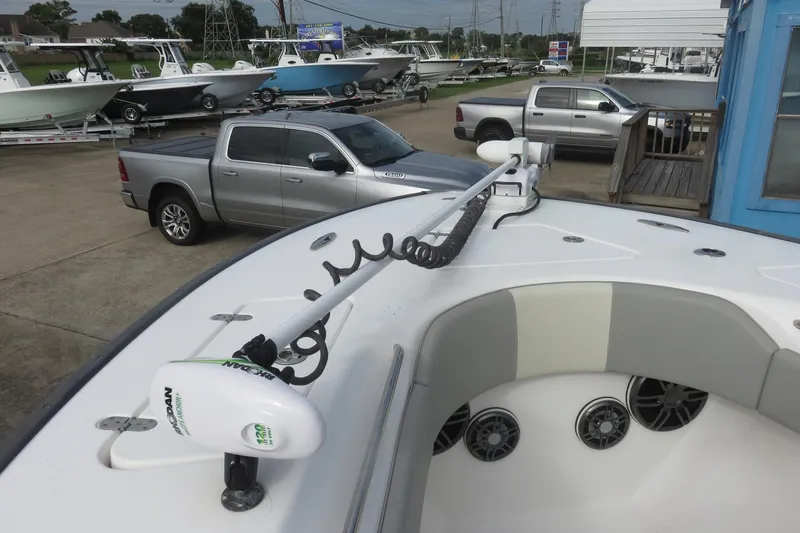 Slide: The Image of 2020 Cape Horn 31 T boat with trolling motor, parked near a truck. - 19