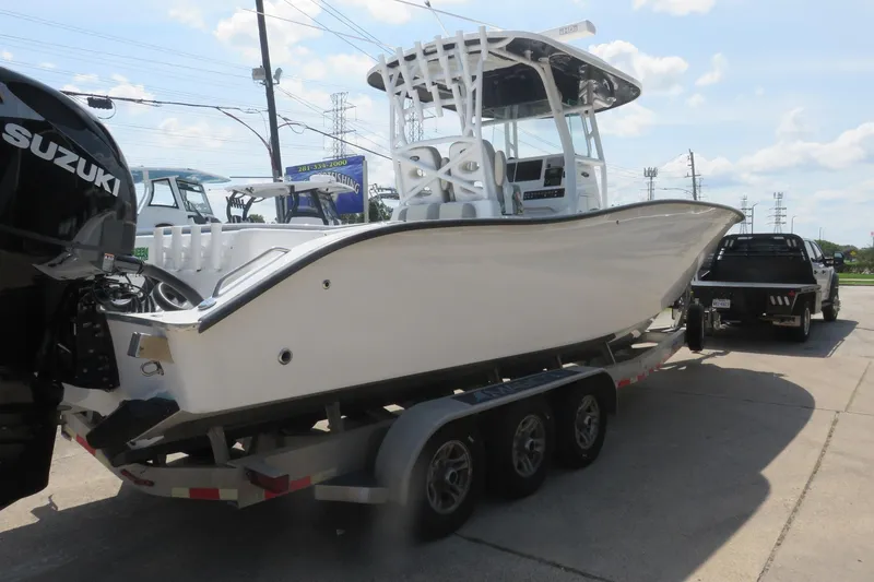 Slide: The Image of 2020 Cape Horn 31 T boat on trailer, side view under clear sky. - 2