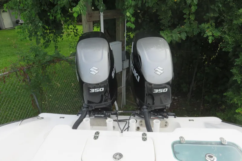 Slide: The Image of 2020 Cape Horn 31 T boat interior with Suzuki 350 engines, featuring seating and storage compartments. - 22