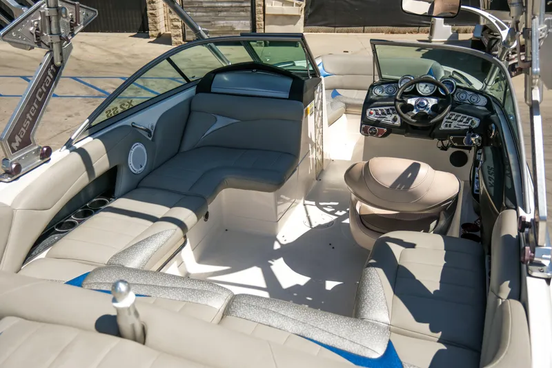 Slide: The Image of 2007 MasterCraft X-2 SS boat interior with plush seating and modern dashboard controls. - 18
