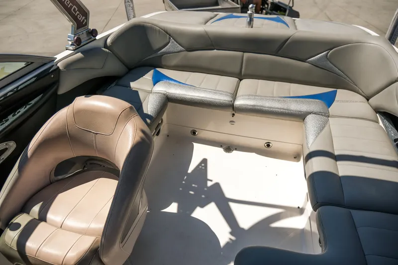 Slide: The Image of 2007 MasterCraft X-2 SS boat interior with beige and gray seating. - 21
