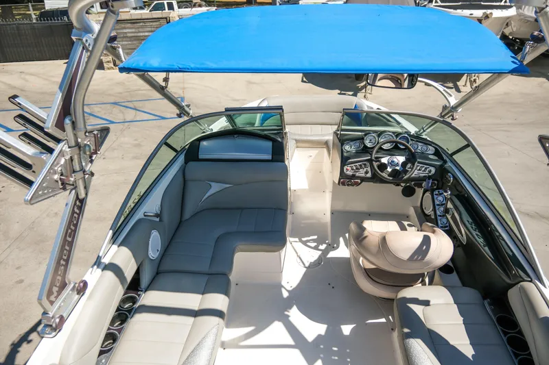 Slide: The Image of 2007 MasterCraft X-2 SS boat interior with blue canopy and modern dashboard. - 24