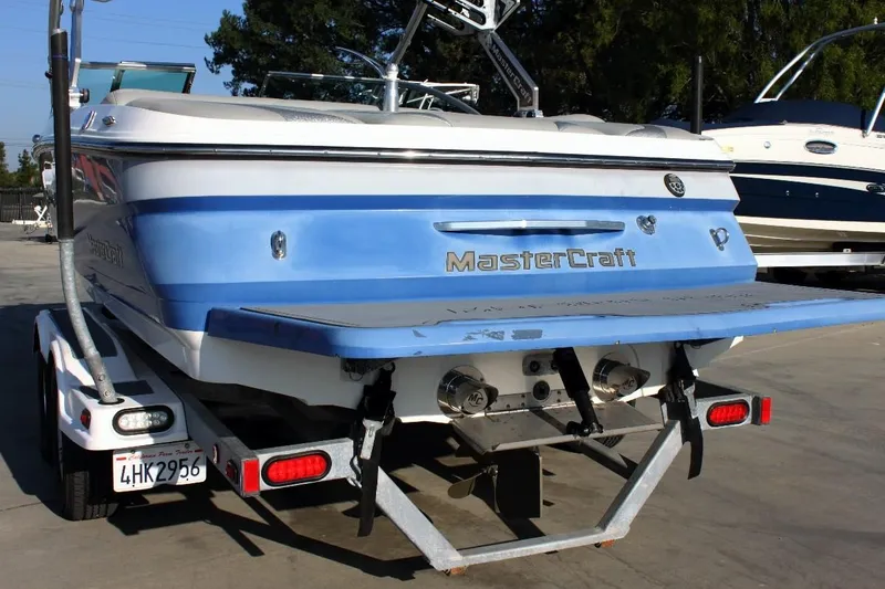 Slide: The Image of 2007 MasterCraft X-2 SS boat on trailer, rear view, blue and white design. - 3