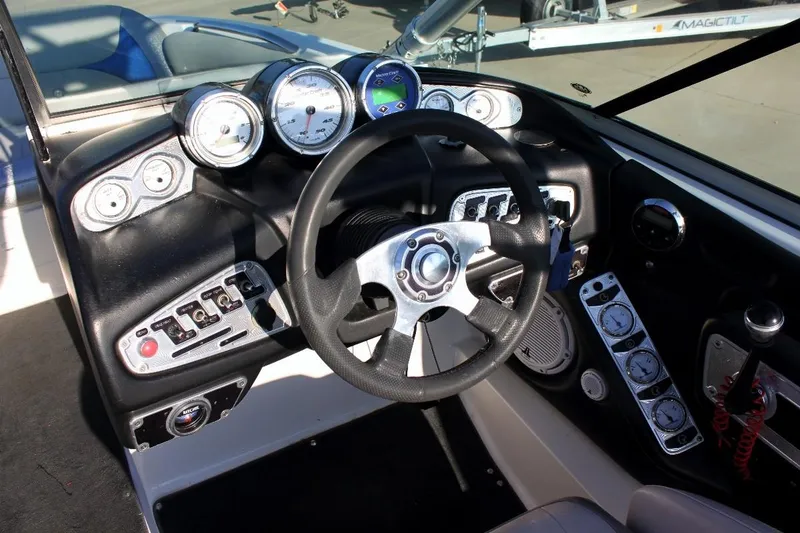 Slide: The Image of 2007 MasterCraft X-2 SS boat dashboard with steering wheel and gauges. - 8