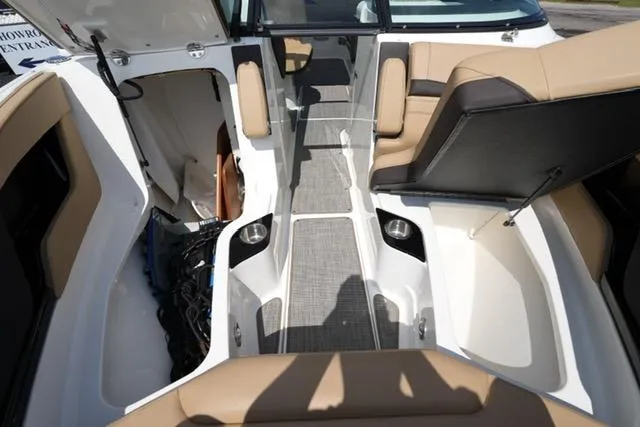 Slide: The Image of 2024 Sea Ray 280 SLX boat interior with beige seating and modern design. - 10