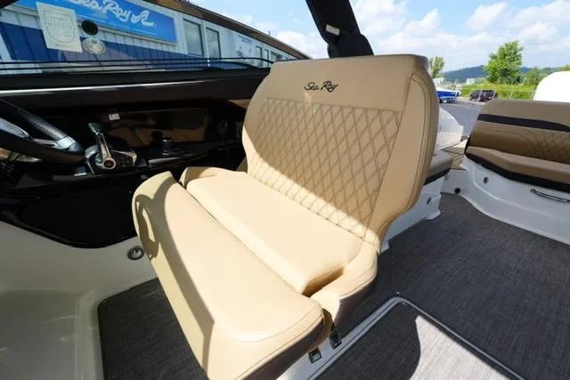 Slide: The Image of 2024 Sea Ray 280 SLX boat interior with luxurious beige seating and modern design. - 14