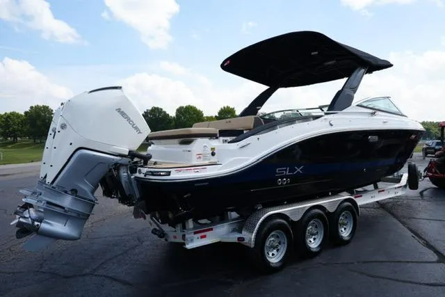 Slide: The Image of 2024 Sea Ray 280 SLX boat on trailer, featuring sleek design and powerful outboard engine. - 4