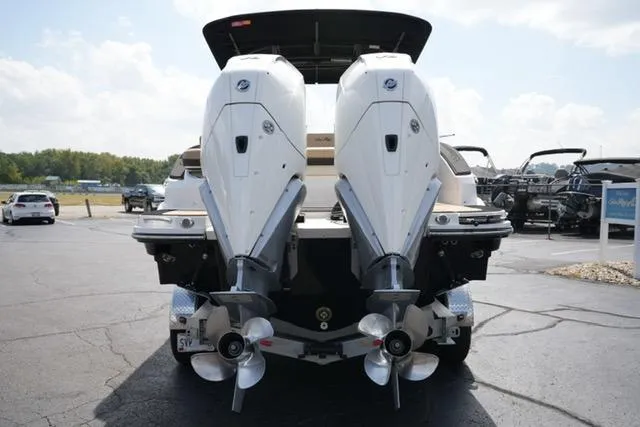 Slide: The Image of 2024 Sea Ray 280 SLX boat with dual outboard engines, rear view on a sunny day. - 5