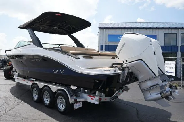 Slide: The Image of 2024 Sea Ray 280 SLX boat on trailer, featuring sleek design and powerful outboard engine. - 6