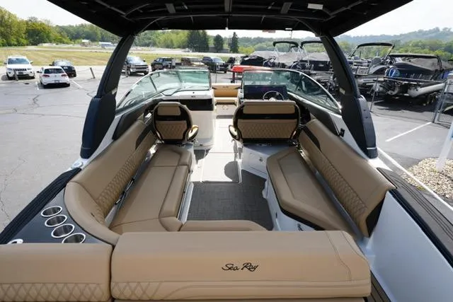 Slide: The Image of 2024 Sea Ray 280 SLX boat interior with luxurious tan seating and sleek design. - 7