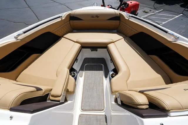 Slide: The Image of 2024 Sea Ray 280 SLX boat interior with tan leather seating and modern design. - 8