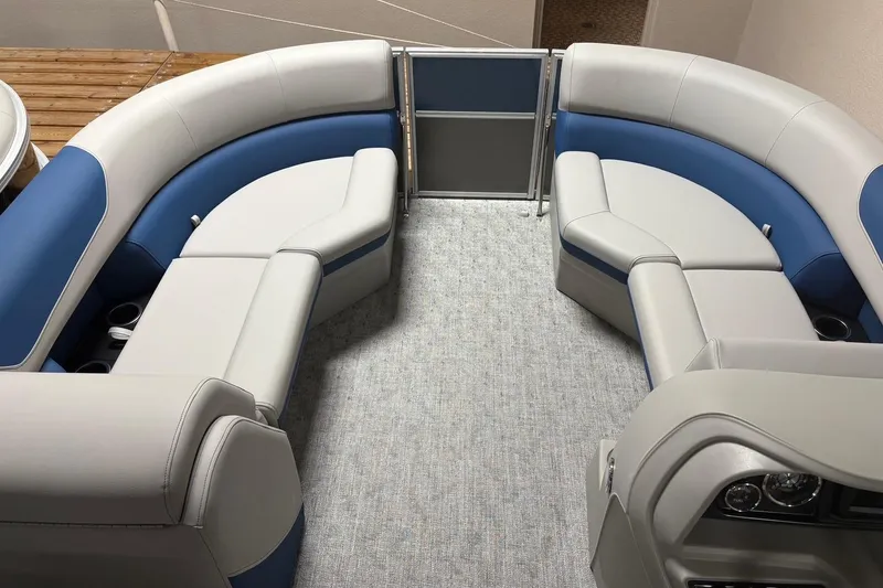 Slide: The Image of 2025 South Bay 222 LE pontoon boat interior with blue and gray seating. - 5