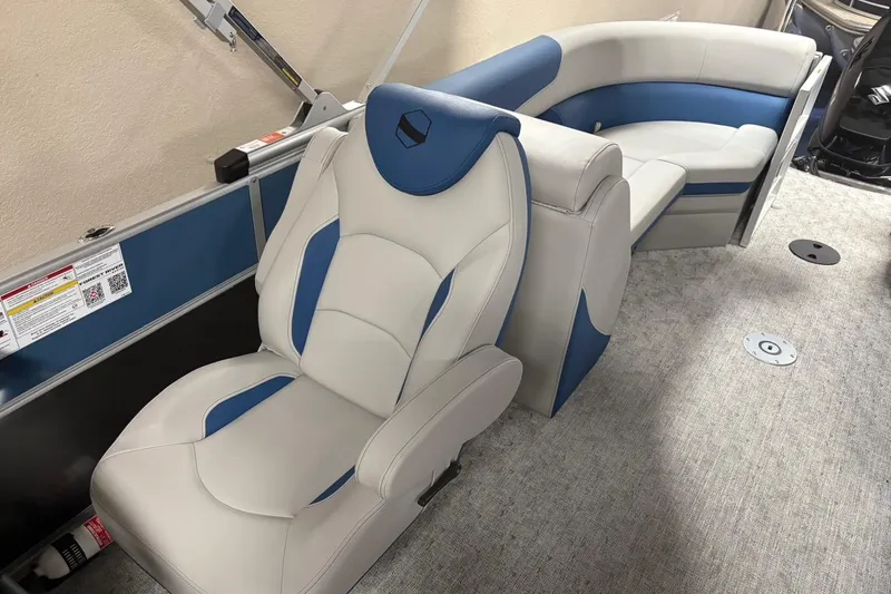 Slide: The Image of 2025 South Bay 222 LE boat interior with blue and white seating, modern design. - 6